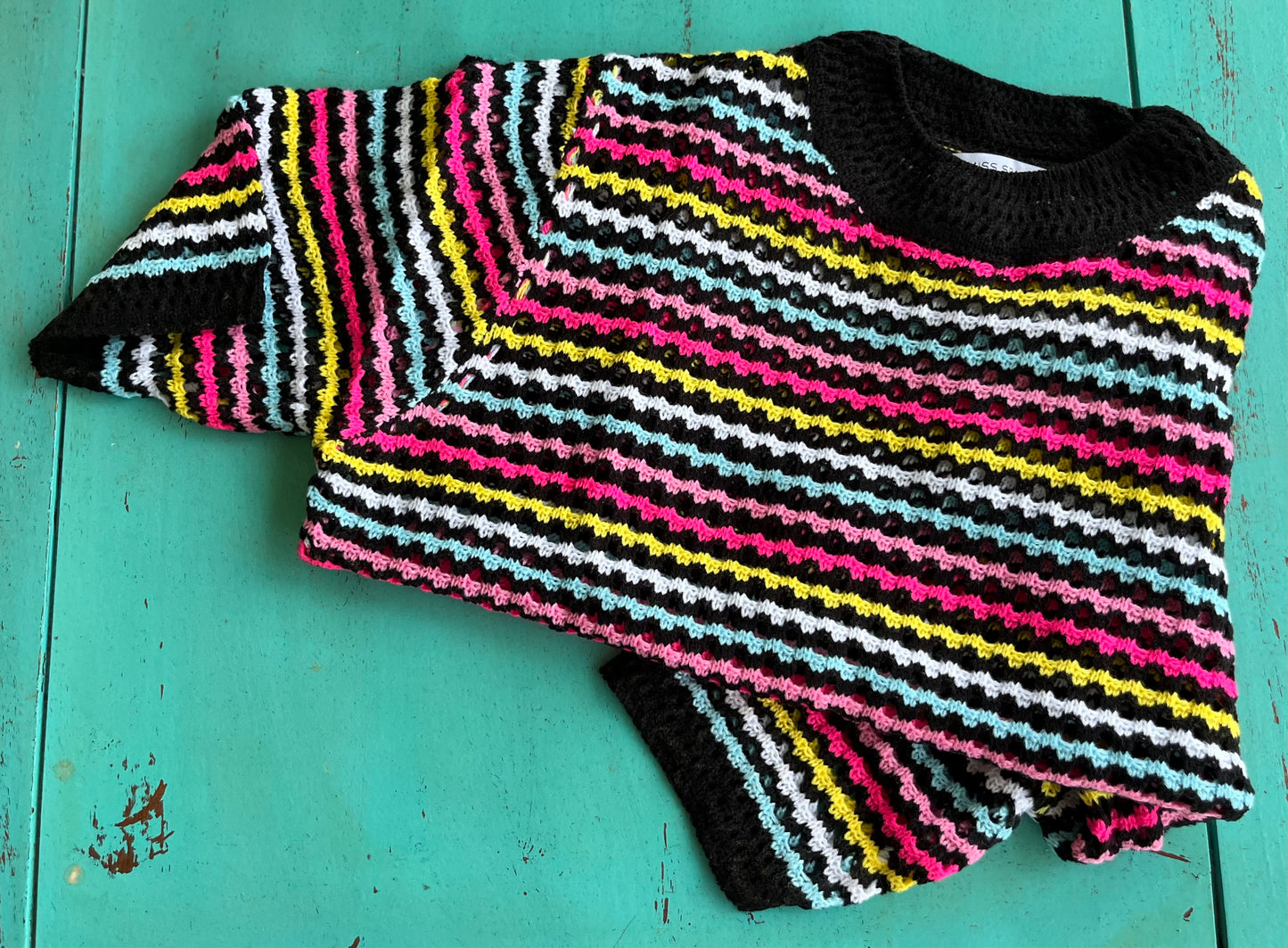 Miss Sparkling brand. Black crocheted semi-sheer with multicolored stripes. S, M, L, XL. $27