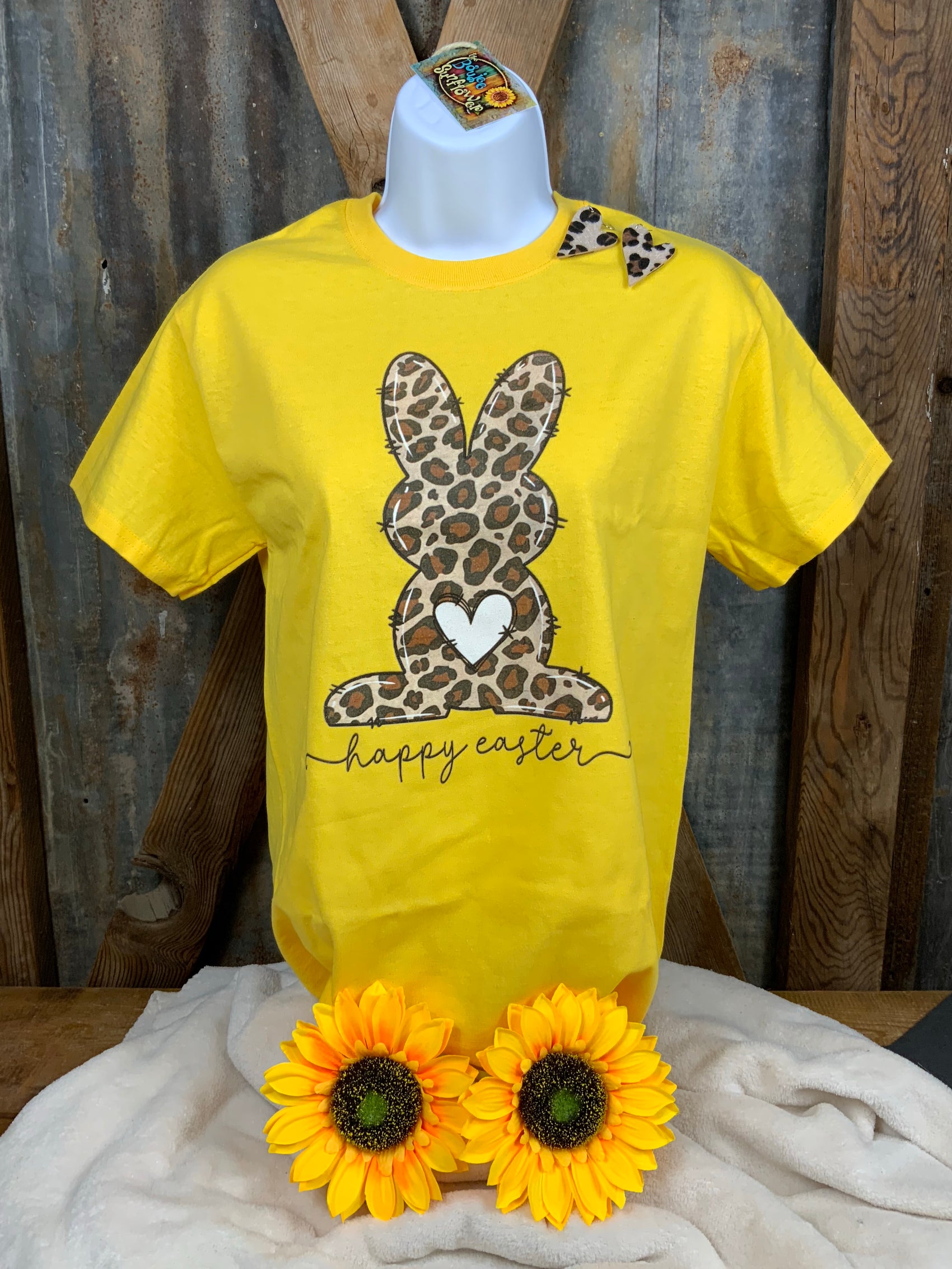 Rocking R Apparel brand. This Cheetah Easter bunny with a white heart tail is on a yellow 100% cotton tee.  S, L $15