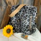 LivFoxy brand. Gray leopard backpack with strap and zippered outer pockets. Tan accented color. Gold hardware. $25